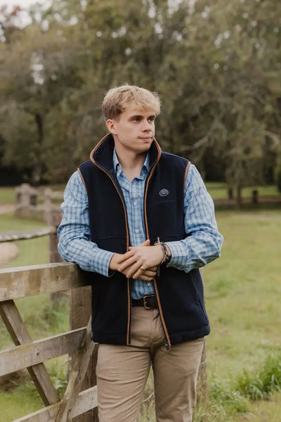 Man in a navy vest showcasing the New Forest Heated Fleece Gilet style