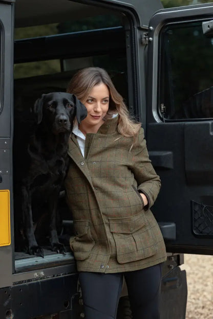 Stylish ladies field coat New Forest Jessica Tweed with black Labrador by open car door