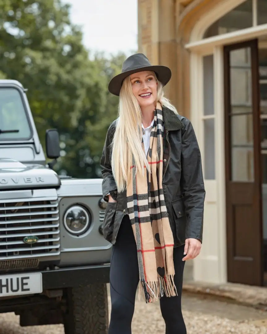 Blonde woman in New Forest Ladies Antique Wax Jacket with british millerain wax forest clothing