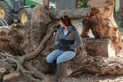 Woman sitting on a tree stump in New Forest Ladies Fox Fibre Pile Fleece, cozy fibre pile fleece