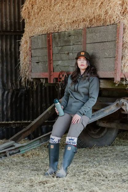 Woman in outdoor clothing wearing the New Forest Ladies Harrier Hoodie, perfect for forest adventures