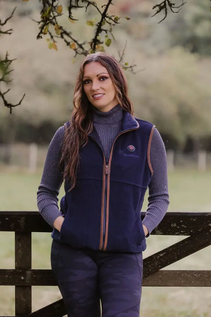 Woman wearing a navy heated fleece gilet, perfect for cozy outdoor adventures