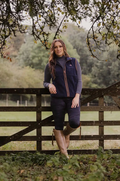 Woman in a navy heated fleece gilet from the New Forest collection