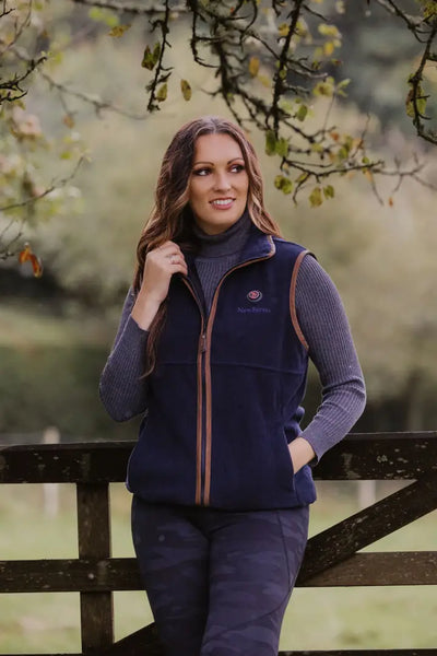 Navy fleece gilet with brown trim, perfect for warmth and style in chilly weather