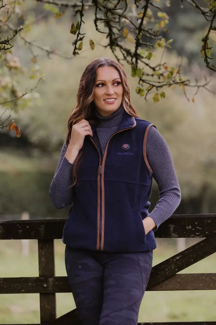 Navy fleece gilet with brown trim, perfect for warmth and style in chilly weather