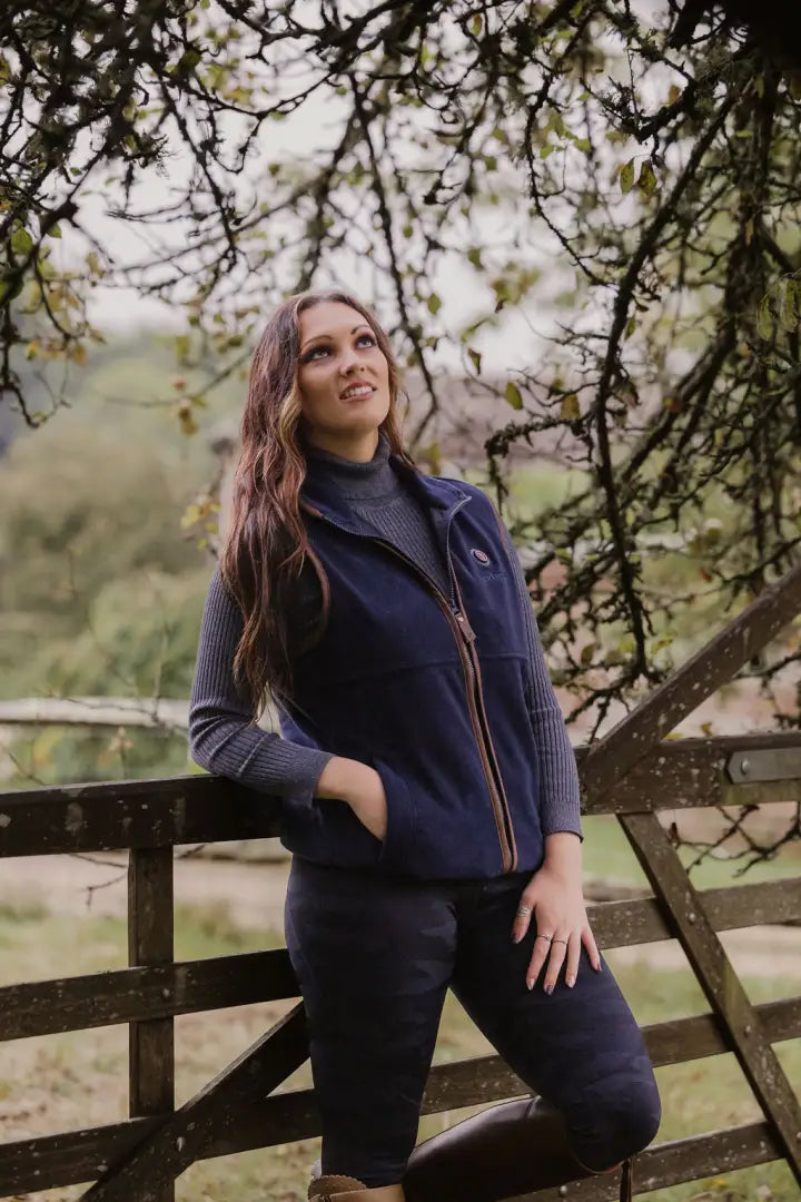 Woman in navy fleece vest showcasing New Forest Ladies Heated Fleece Gilet