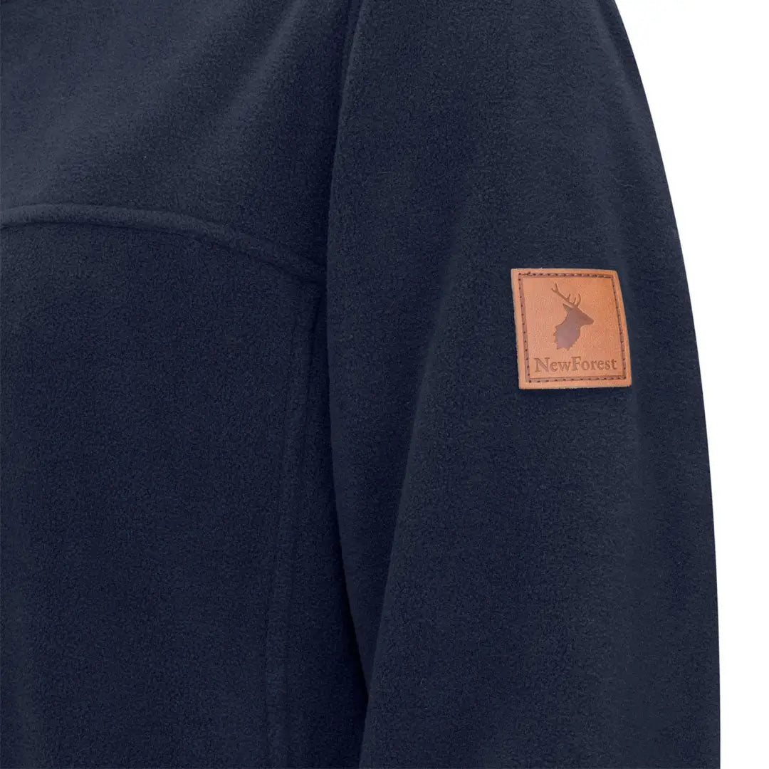 Dark navy quarter zip fleece jacket with deer patch and New Forest text