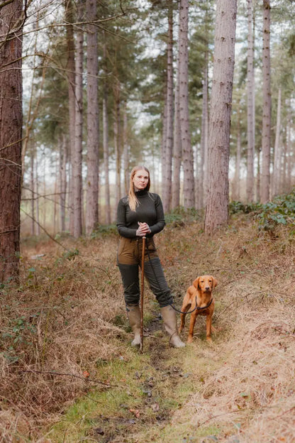 Woman with dog in forest wearing stylish Forest Nightjar Trousers for outdoor fun