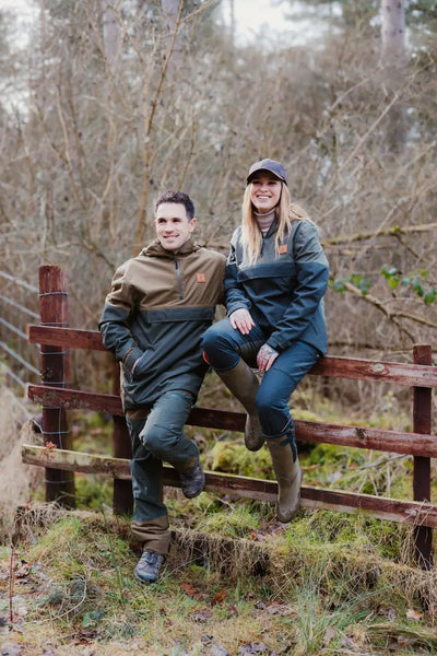 Couple modeling New Forest Ladies Nightjar Trousers in a scenic outdoor setting