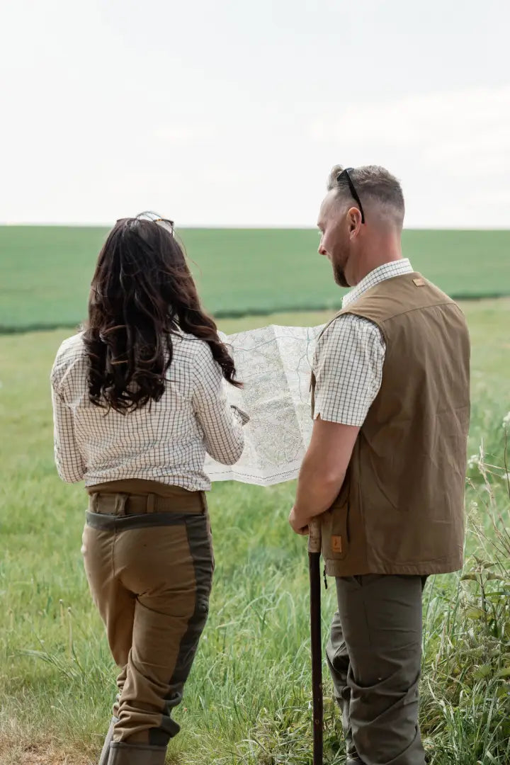 Two people exploring outdoors wearing New Forest Ladies Nightjar Trousers in the forest