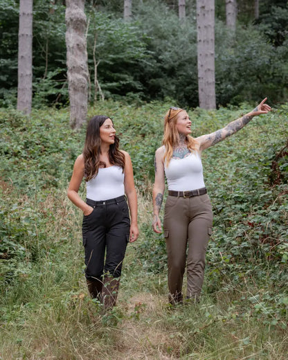 Two women hiking in a forest with New Forest Ladies Outdoor Stretch Trousers