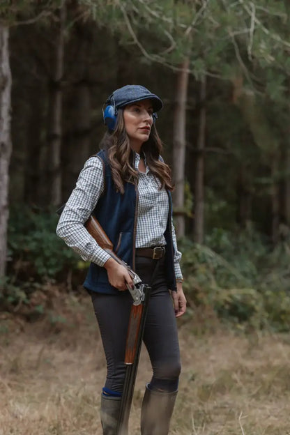 Woman in shooting attire wearing a New Forest Ladies Premium Tattersall Shirt