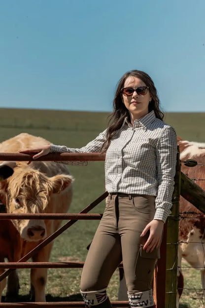 Woman in riding attire wearing the New Forest Ladies Premium Tattersall Shirt, your favourite country shirt