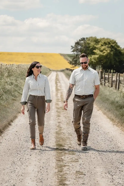 Couple wearing New Forest Ladies Premium Tattersall Shirt walking on a dirt road in countryside