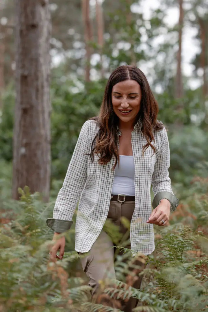 Woman in a plaid shirt showcasing the New Forest Ladies Premium Tattersall Shirt
