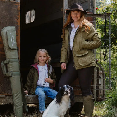 Horse trailer with people and a dog showcasing a fantastic quality ladies tweed jacket