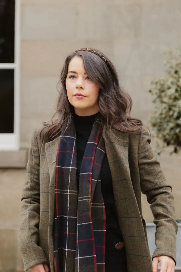 Woman wearing the Forest Lizzie Tweed Coat with a stylish plaid scarf