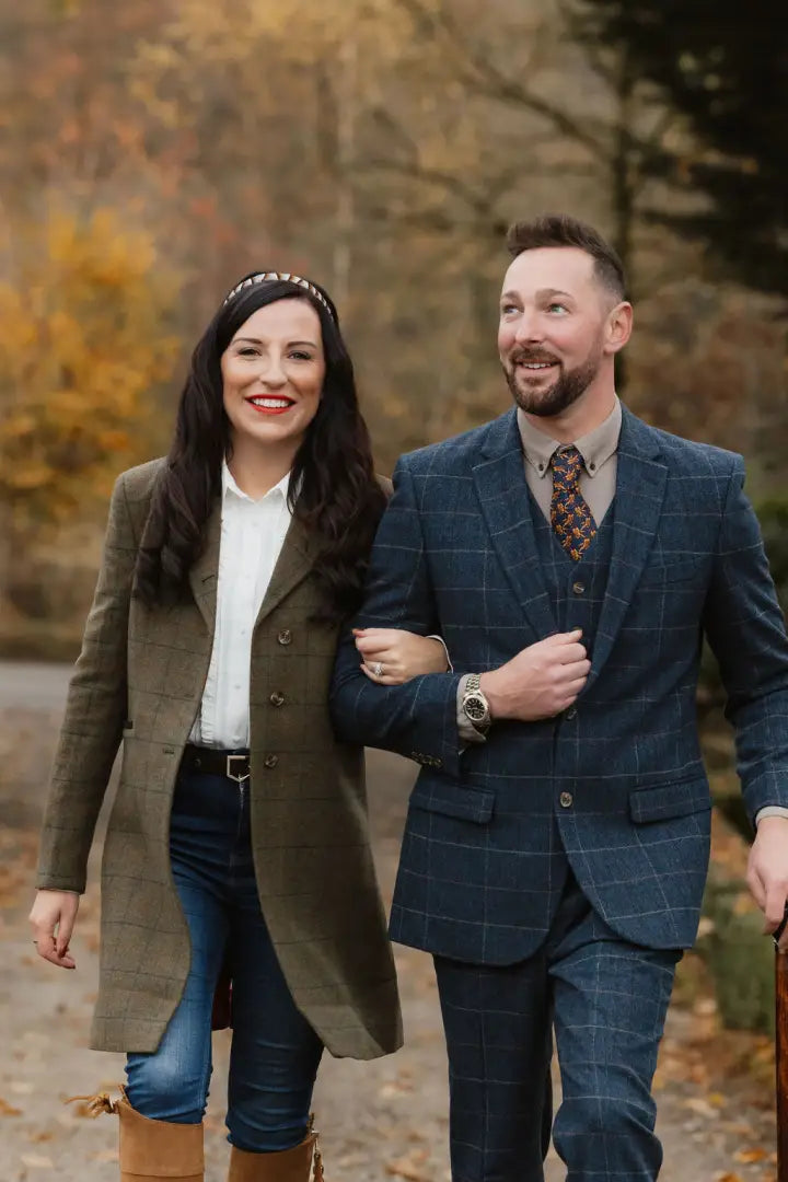 Well-dressed couple outdoors rocking the stylish Forest Lizzie Tweed Coat