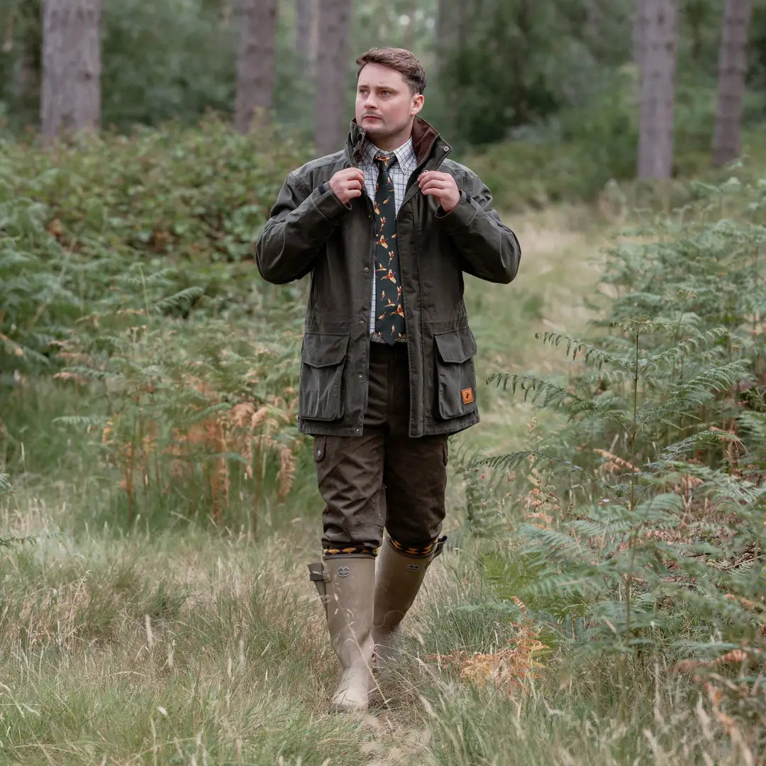Man in outdoor attire wearing the New Forest Marsh Jacket, perfect for forest marsh adventures
