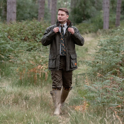 Man in outdoor attire wearing the New Forest Marsh Jacket, perfect for forest marsh adventures