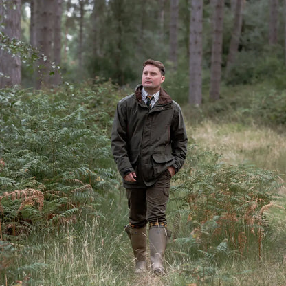 Man in outdoor attire wearing the New Forest Marsh Jacket for forest marsh adventures
