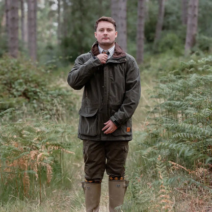 Man in olive green forest marsh jacket, perfect for hunting or outdoor adventures
