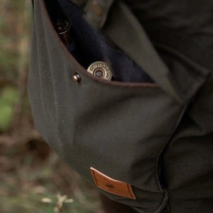 Green canvas hunting bag with shotgun shells for the New Forest Marsh Jacket in forest marsh style