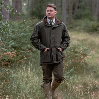 Man in outdoor clothing wearing the New Forest Marsh Jacket, perfect for forest marsh adventures