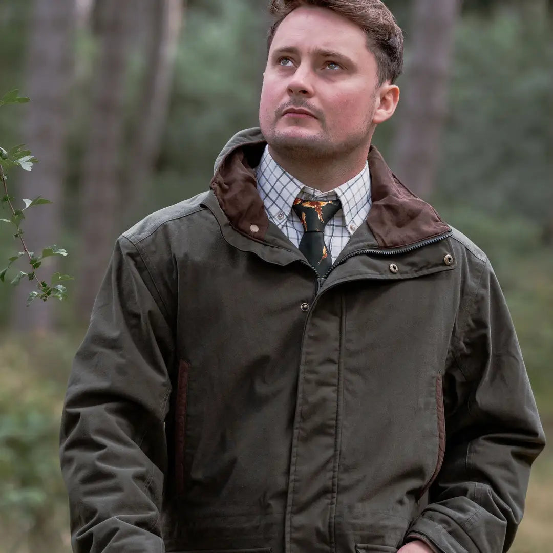 Man wearing olive green forest marsh jacket in the New Forest Marsh Jacket collection