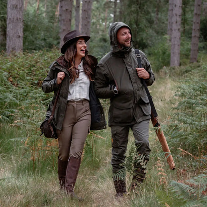 Two people in hunting attire showcasing the New Forest Marsh Jacket in forest marsh style
