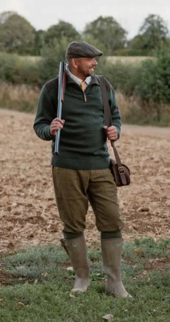 Man in country attire holding shotgun and satchel wearing Forest Maverick Waterproof Tweed Breeks
