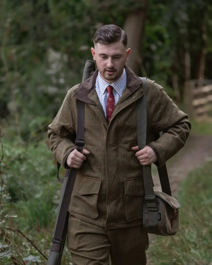 Man wearing New Forest Maverick Waterproof Tweed Breeks and shooting jacket
