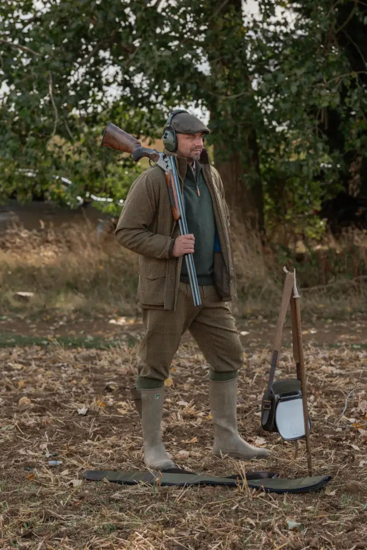 Man in hunting attire wearing New Forest Maverick waterproof tweed jacket, sophisticated field coat
