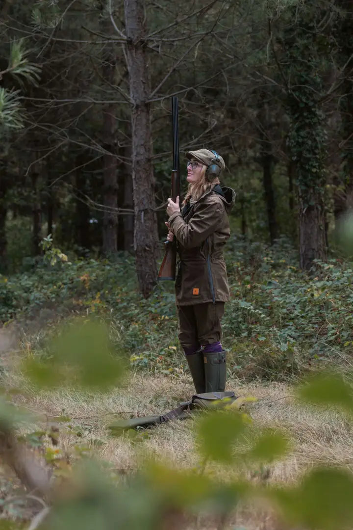 Young woman in hunting attire wearing the New Forest Maverick waterproof tweed jacket