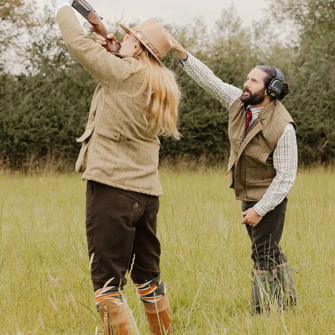 Two people enjoying clay pigeon shooting in New Forest Moleskin Breeks