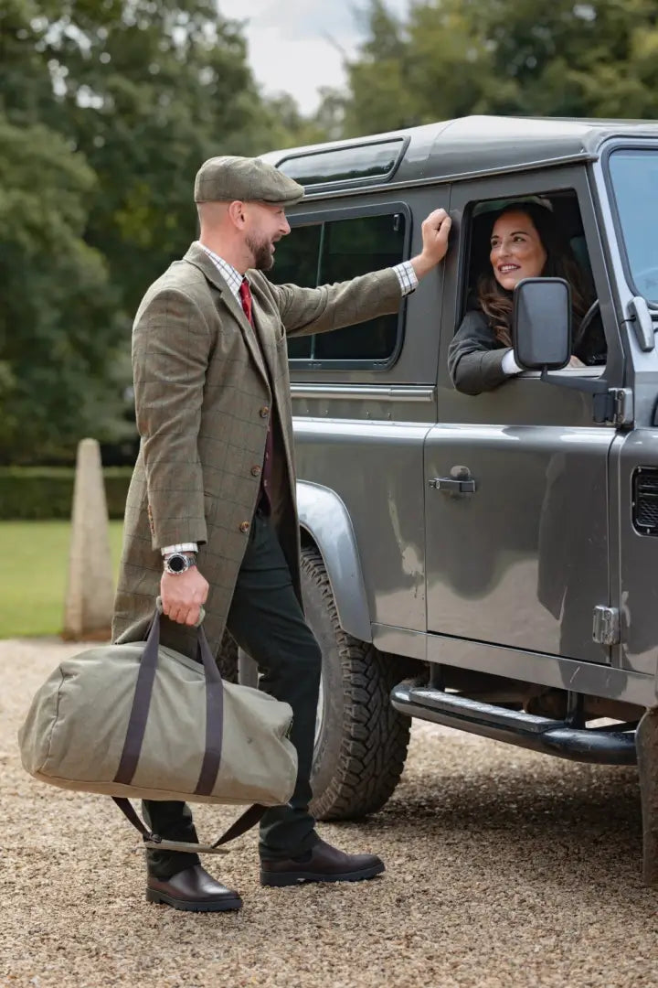 Rugged gray four-door SUV with New Forest Moleskin Jeans in outdoor style