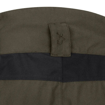 Green and black fabric featuring a deer logo on New Forest Nightjar Trousers