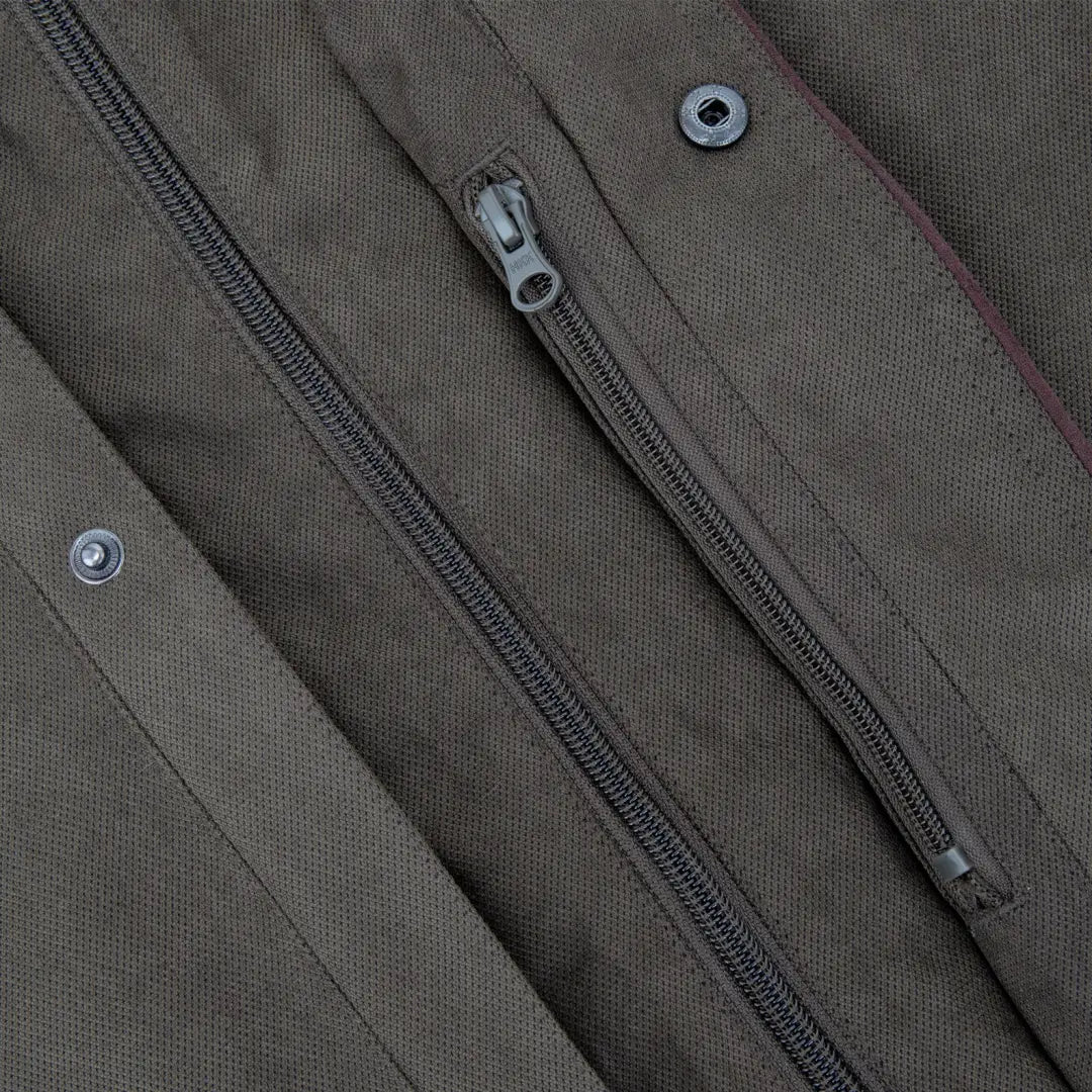 Zipper detail on New Forest Performance Field Coat with metal snaps on khaki fabric
