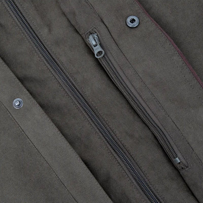 Zipper detail on New Forest Performance Field Coat with metal snaps on khaki fabric