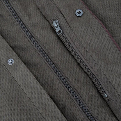 Zipper detail on New Forest Performance Field Coat with metal snaps on khaki fabric