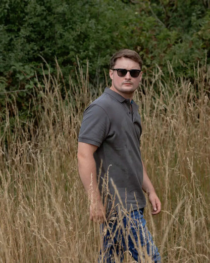 Man in sunglasses wearing a New Forest Pique Polo Shirt, perfect forest pique polo style
