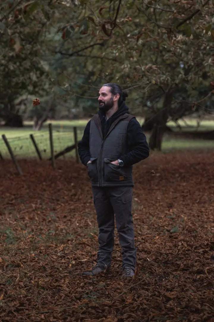 Man wearing a dark vest and long-sleeve shirt in New Forest Polar Gilet outdoor gear