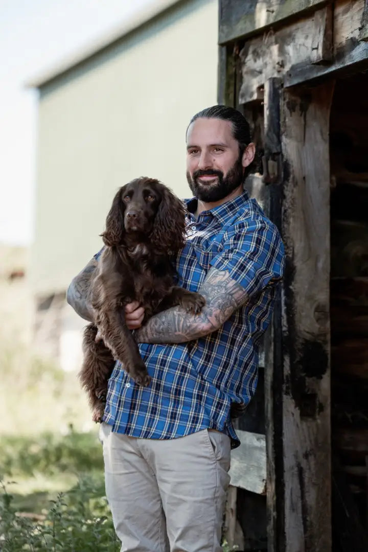 Man holding brown dog in New Forest Premium 100% Cotton Short Sleeve Shirt