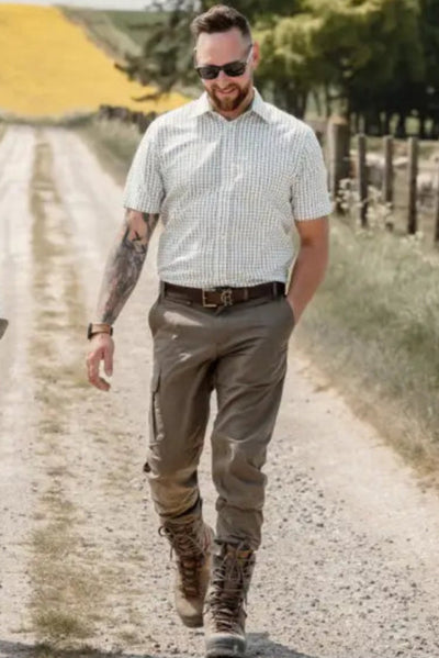 Couple walking on dirt road wearing New Forest Premium 100% Cotton Short Sleeve Shirt
