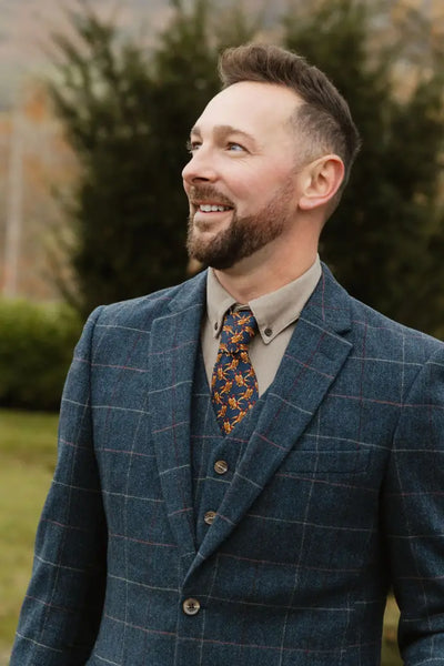 Man in a blue plaid suit rocking a New Forest Premium wool tweed blazer