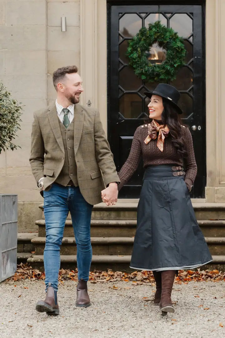 Couple holding hands, showcasing the stylish New Forest Wool Tweed Waistcoat
