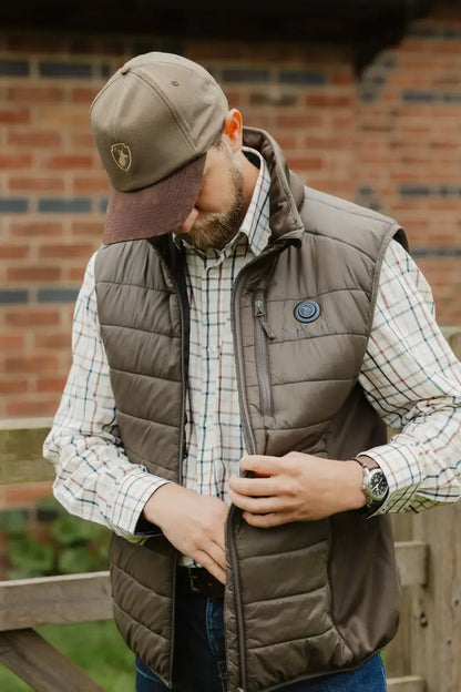 Brown quilted vest paired with a New Forest Stag Baseball Cap for a stylish look