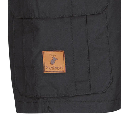 Leather patch with deer logo and New Forest text on dark pocket of Trail Shorts