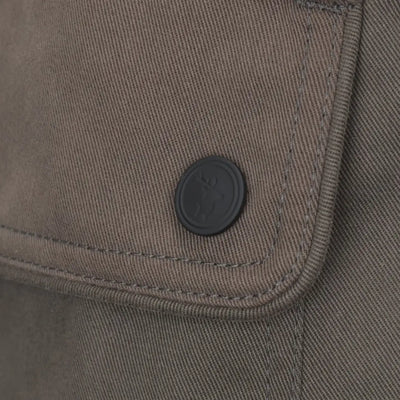 Olive-green fabric pocket with a dark button on New Forest Woodland Trousers