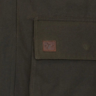 Olive green pocket with brown label on New Forest Woodsman Wax Jacket for forest woodsman style